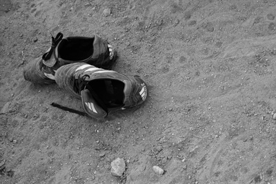 Boots on dirt pitch