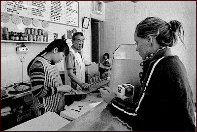 Mr Chaw and his daughter Linda in The Goodison chip shop. Mr Chaw's has been here for the last 35 years. These businesses depend on fans and workers at Goodison for their income and many fear they will be badly hit by the move.